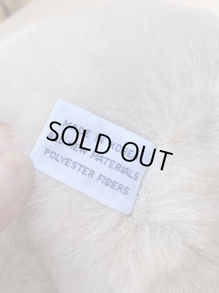 リボンを付けたビンテージのテディベア