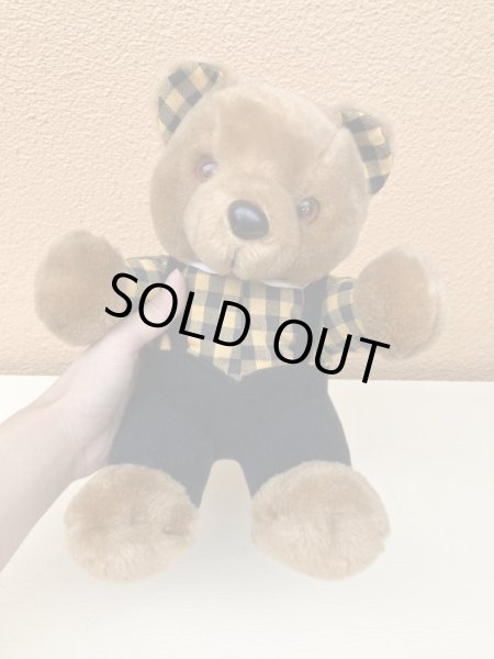 ギンガムチェックの服を着たビンテージのテディベア