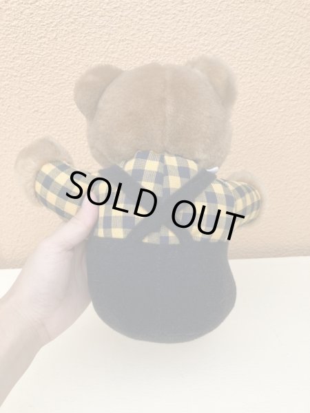 ギンガムチェックの服を着たビンテージのテディベア