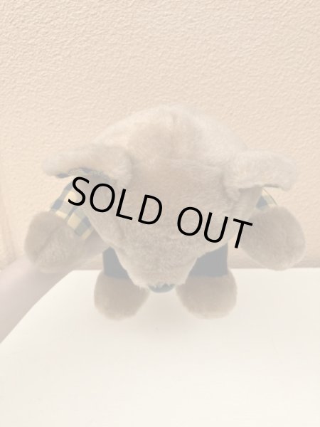 ギンガムチェックの服を着たビンテージのテディベア