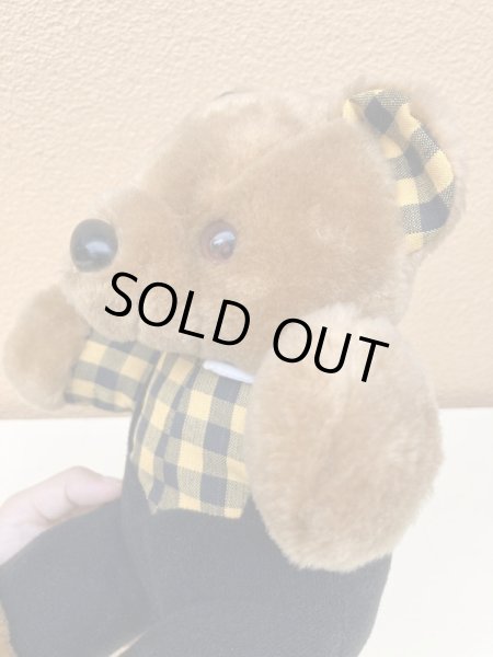 ギンガムチェックの服を着たビンテージのテディベア