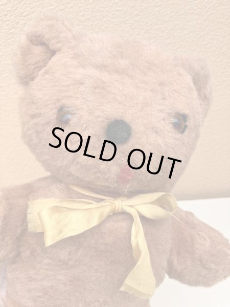 リボンの付いたビンテージのオールドテディベアのぬいぐるみ