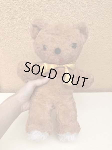 リボンの付いたビンテージのオールドテディベアのぬいぐるみ